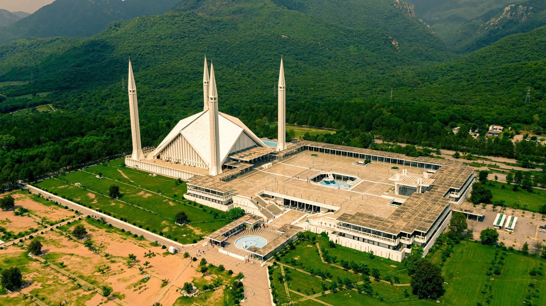 Faisal Mosque below the green Margalla Hills, Islamabad, from the air