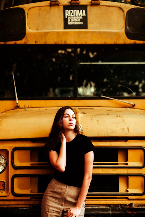 Portrait of Woman by Yellow School Bus