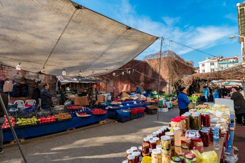 Stalls with Vegetables and Preserves at the Market