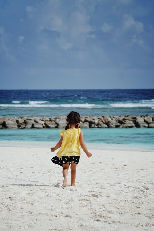 Free Girl on Beach on Sea Shore Stock Photo