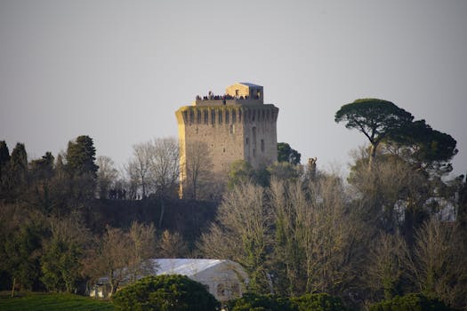 Discover Torre di Oriolo amid lush foliage, capturing Italy's historic and rural charm.