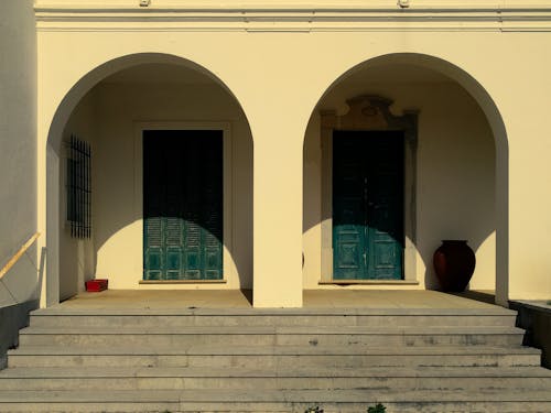 Sunlit Building Wall with Arches