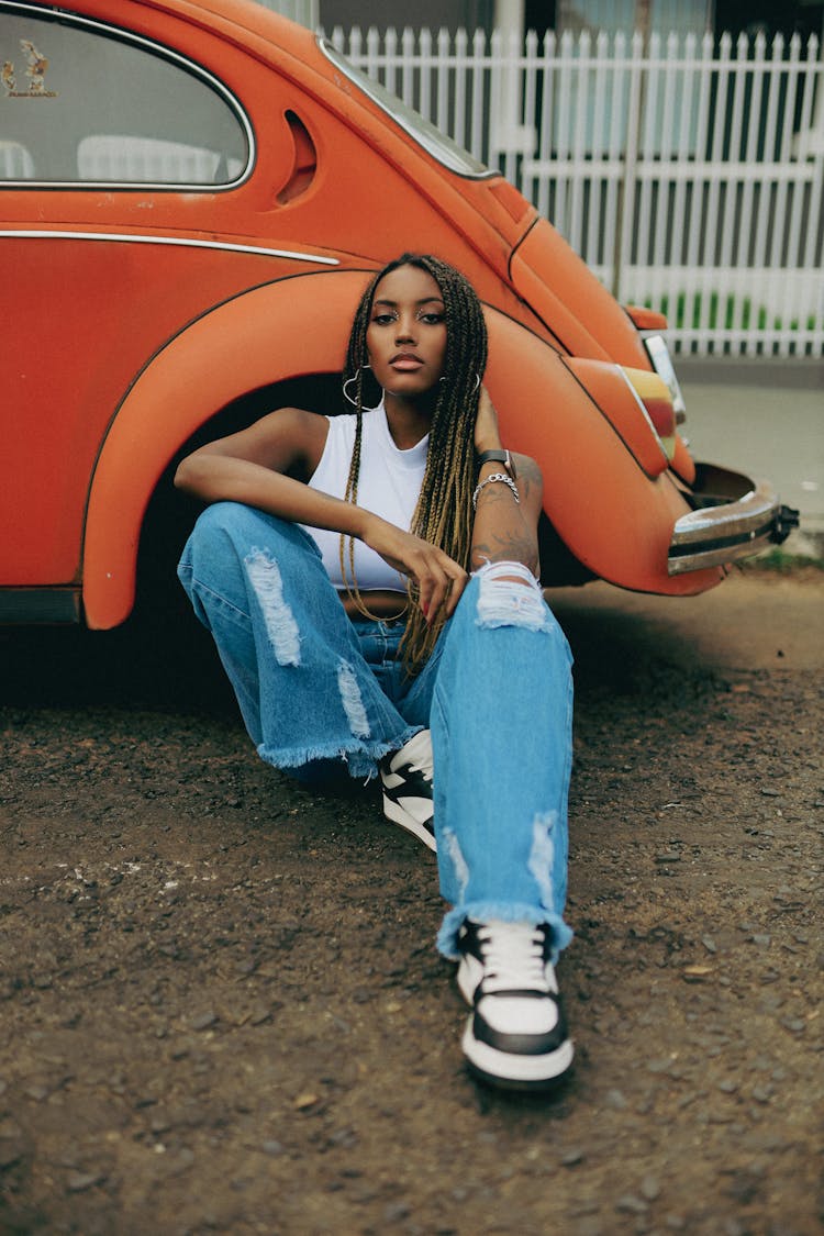 Beautiful Woman Wearing Jeans And Braids