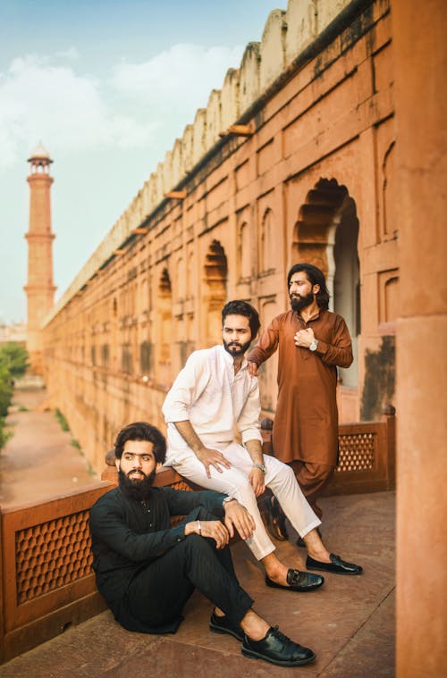 Men Posing in Traditional Clothing