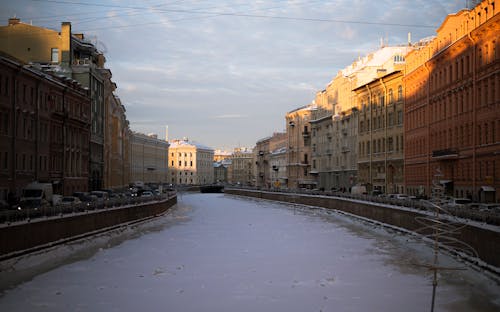 Clouds over Frozen River in City in Winter