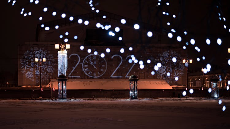 Clock Illuminated On Urban Wall