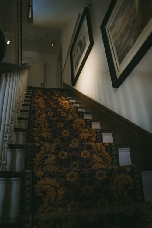 Free A beautifully decorated staircase with ornate carpet in an interior of a Key West home. Stock Photo