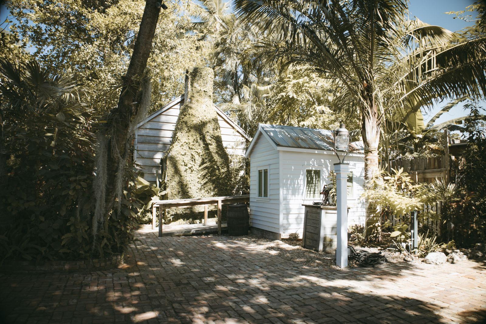 Backyard outbuilding in a landscaped garden