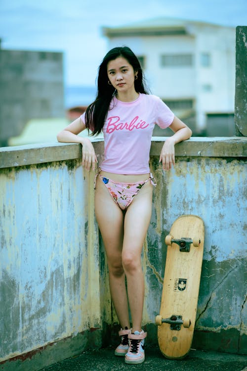 Brunette Woman in Pink T-Shirt and Panties Posing on Rooftop