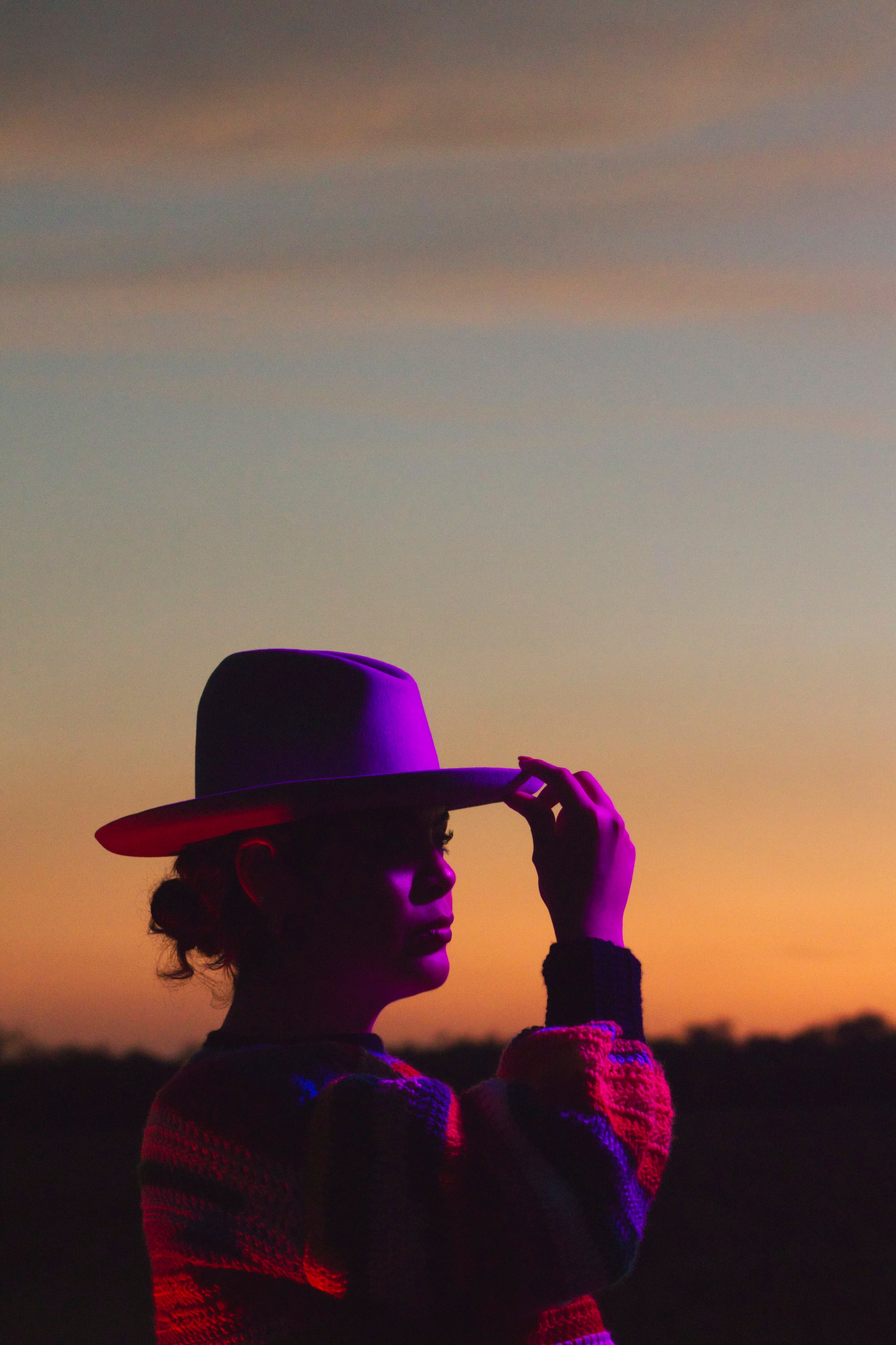 Portrait of Woman in Hat at Sunset · Free Stock Photo