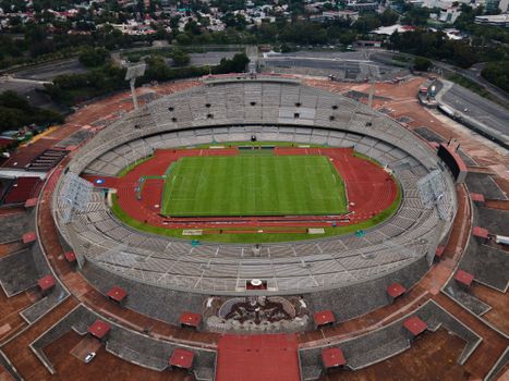 A breathtaking aerial view of Estadio Olímpico Universitario in Mexico City, showcasing its grand architecture.