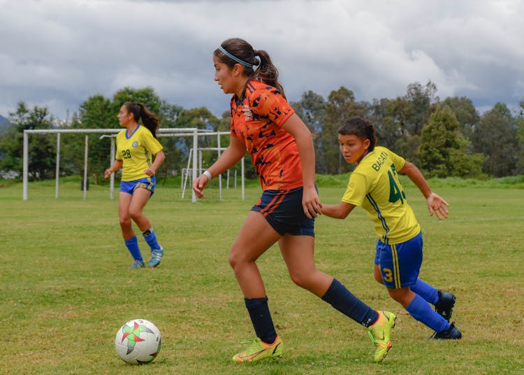 Teenagers Playing Soccer