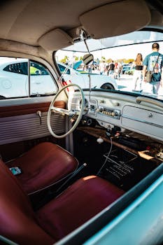 Explore the classic interior of a vintage car at an auto show in West Palm Beach, Florida.