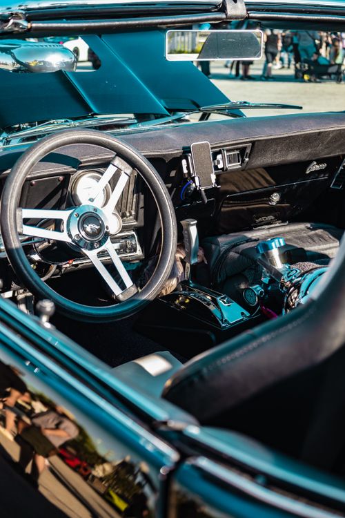 Free Close-up of a classic convertible car interior showcasing the steering wheel and dashboard. Stock Photo