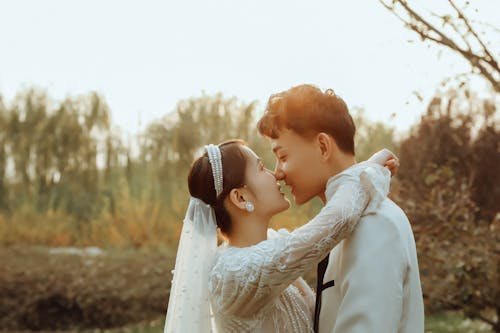 Young Bride and Groom Kissing 