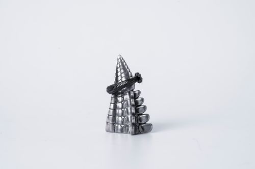 Free Close-up of a detailed silver ouroboros ring shaped like a snake tail on a white background. Stock Photo