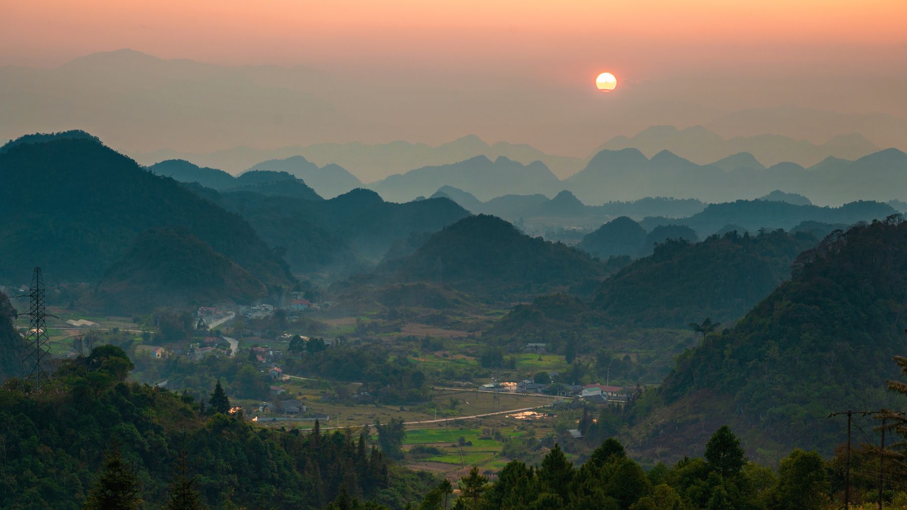 Misty valley at sunrise — photo by Thành Peter on Pexels