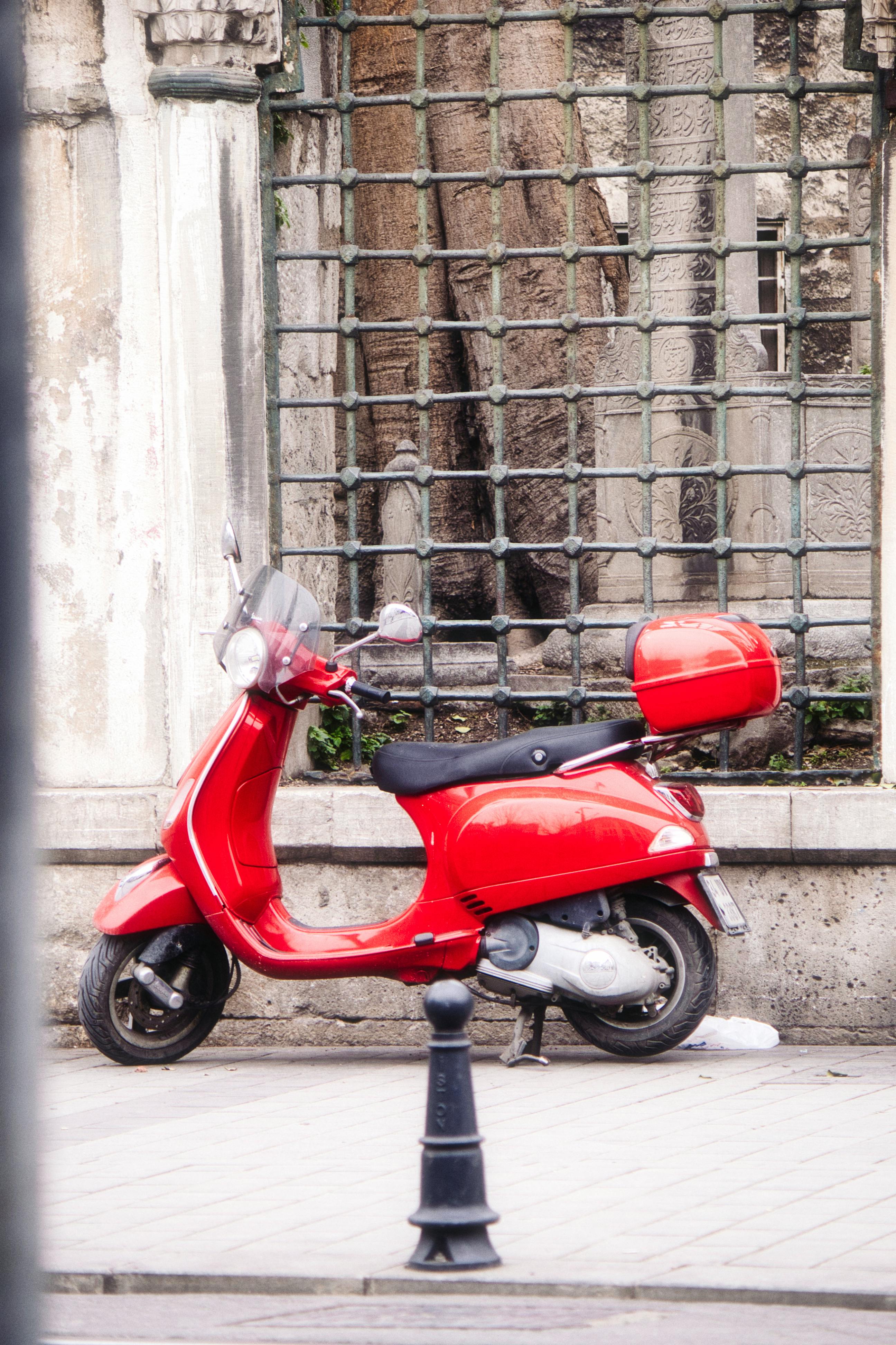 Scooter Parked on Sidewalk · Free Stock Photo