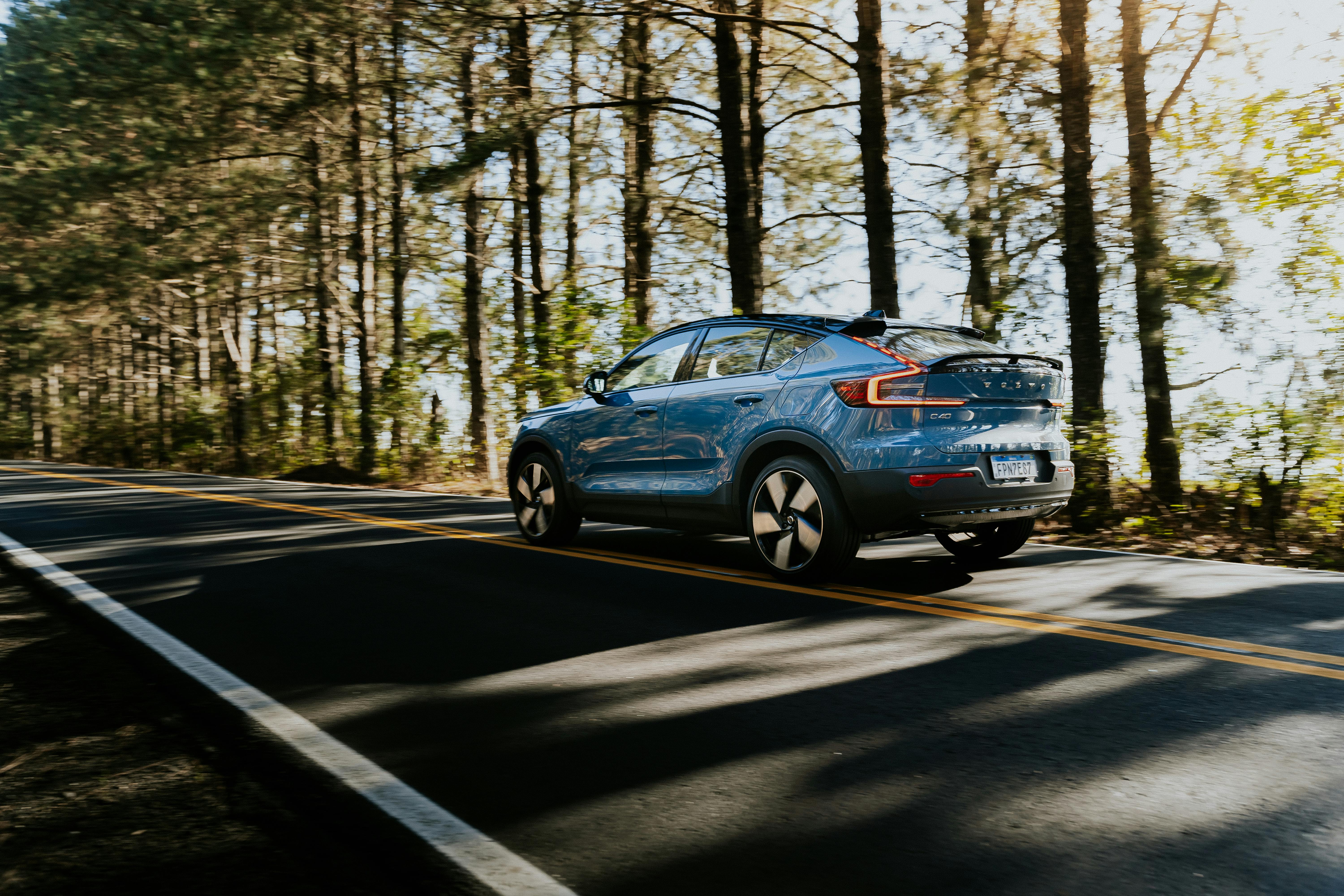 blue volvo c40 recharge on an asphalt road