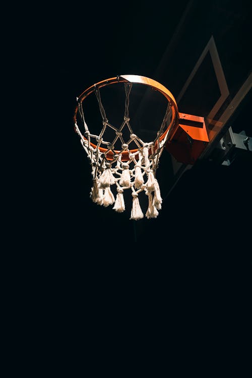 Basketball Hoop with White Net at Night