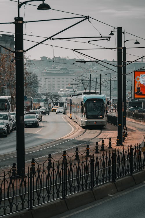 A Tram and a Busy City Street 