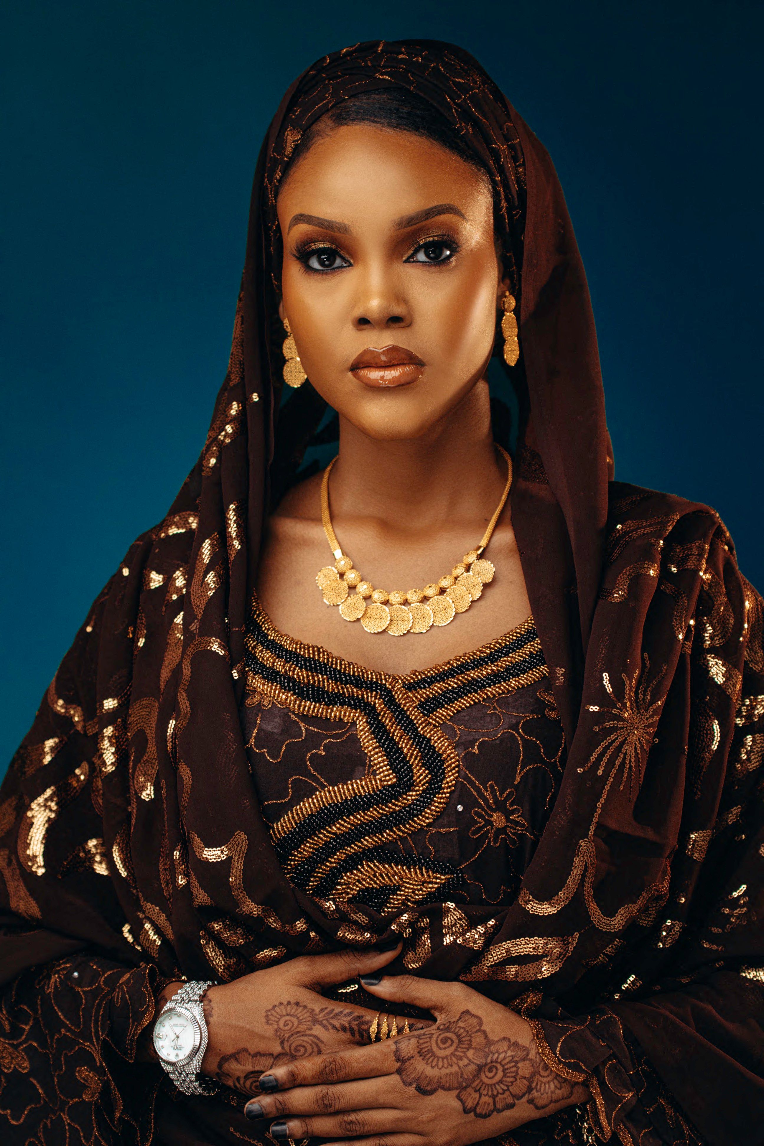 Portrait of a Young Woman in a Traditional Dress and Gold Jewelry ...