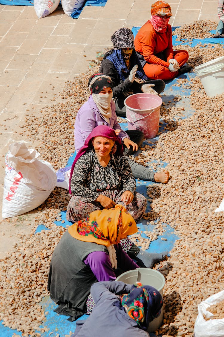 Sitting Women Working On Farm