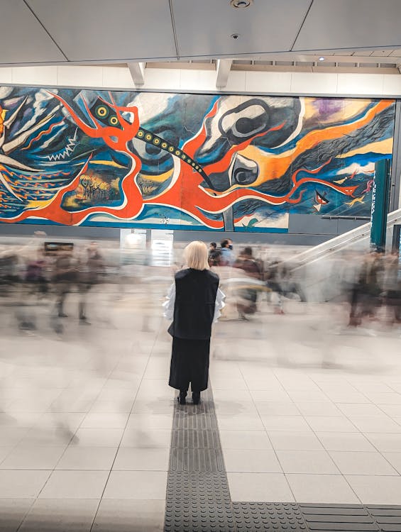 Person Standing on Subway Platform