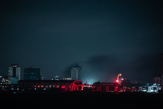 A captivating cityscape at night with glowing skyscrapers and vibrant city lights.