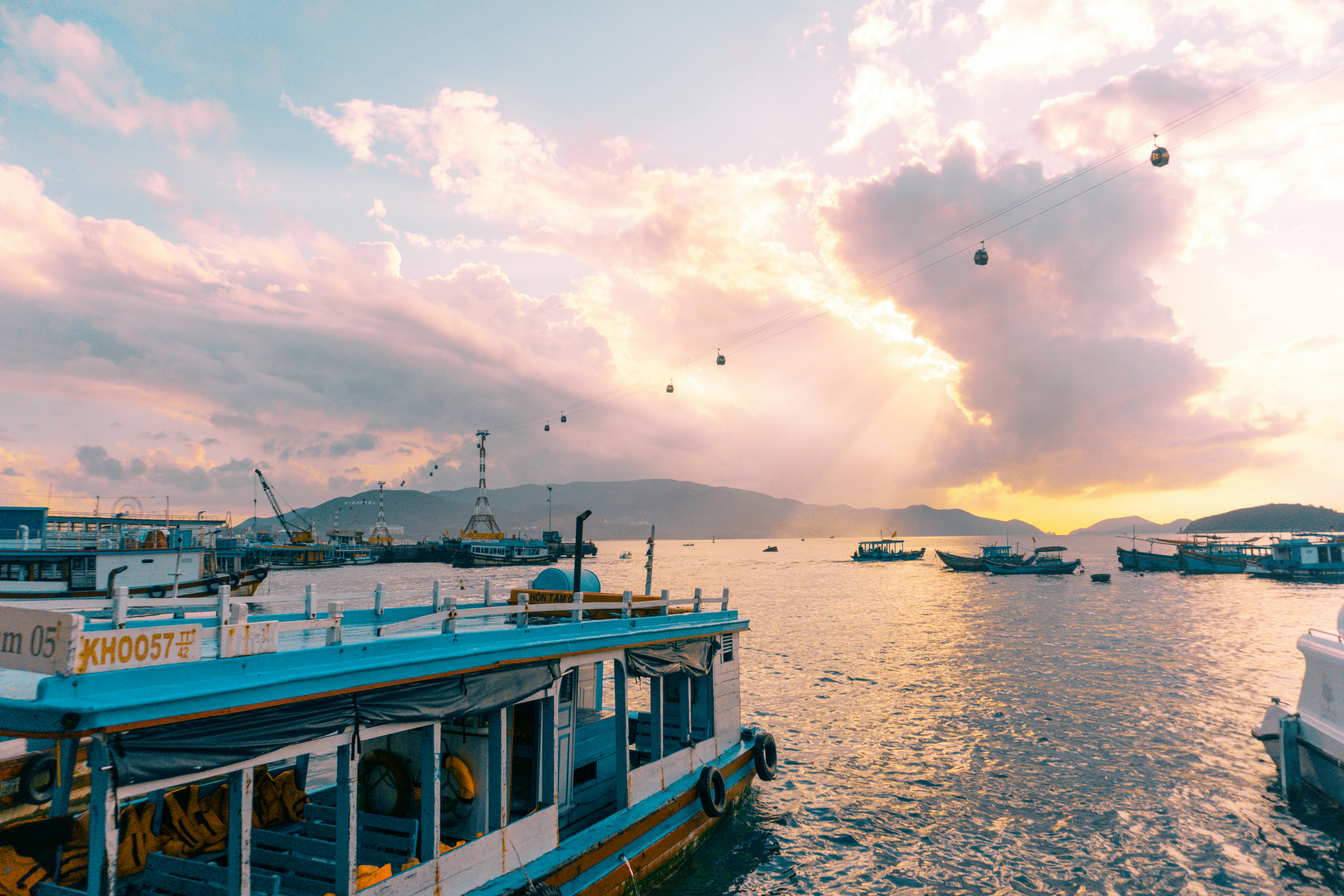 White And Blue Boat On Body Of Water · Free Stock Photo