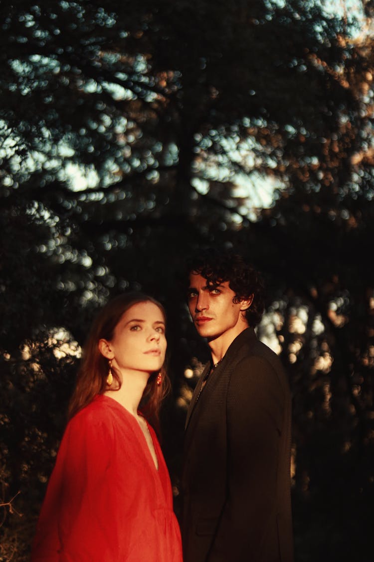 Young Man And Woman In A Forest 