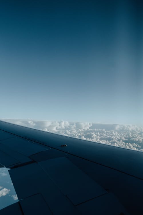 Clear Sky behind Airplane Wing