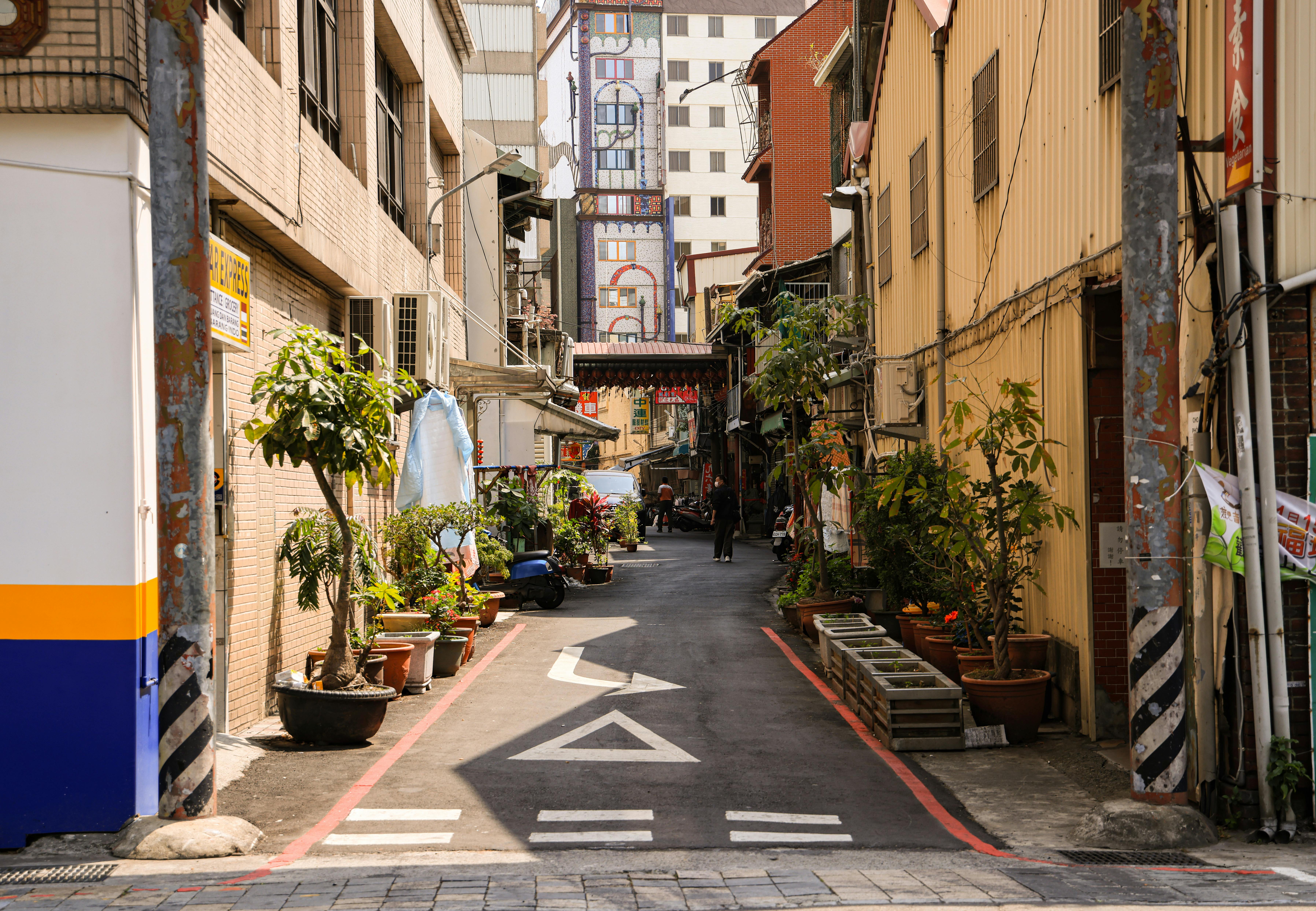 a vibrant street in Chicago's Pilsen neighborhood with colorful murals - Apartments near UIC