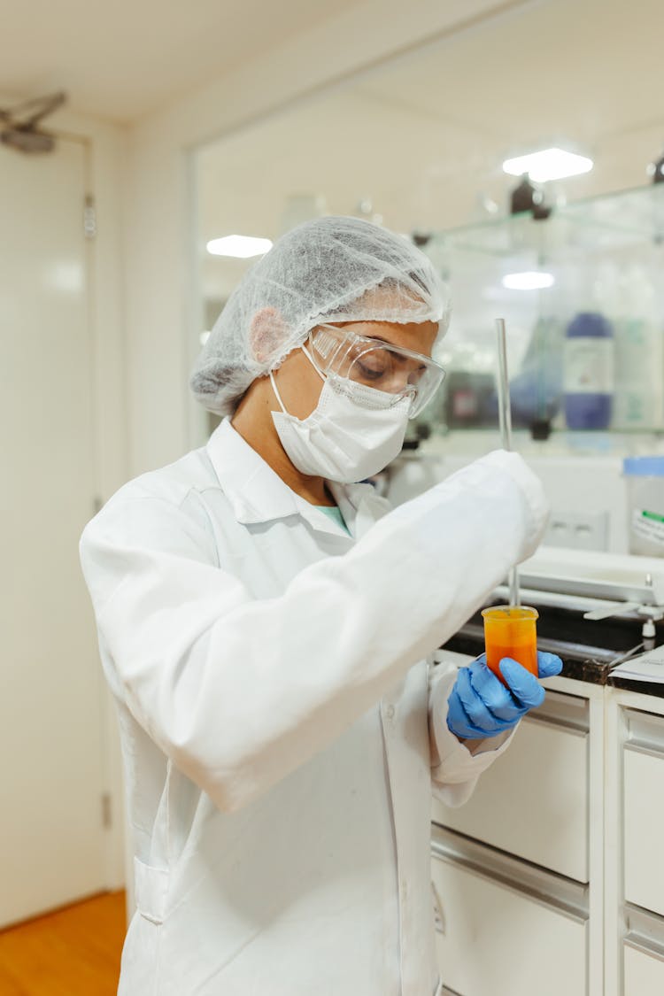 Laboratory Worker Holding A Test Tube 