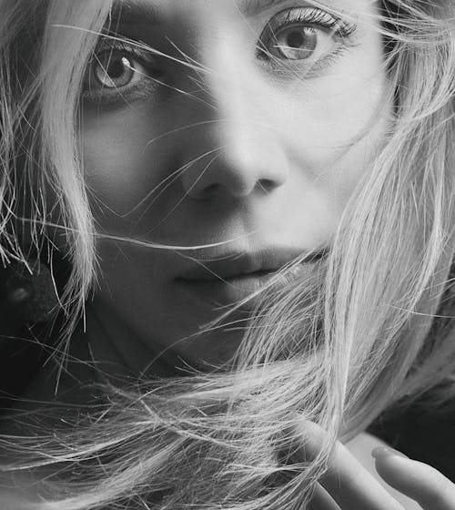 Black and White Closeup Portrait of a Blonde Woman with Tousled Hair