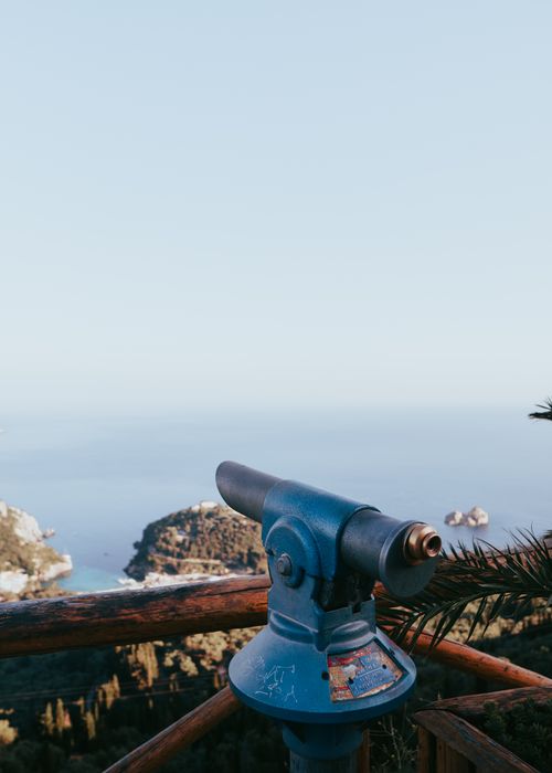 Free Discover the stunning coastal scenery of Kerkyra with a blue tower viewer overlooking the sea and islands. Stock Photo