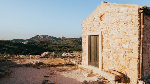 Foto profissional grátis de alvorecer, cair da noite, casa de pedra