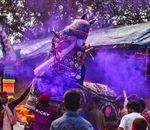 Colorful cultural festival in Odisha, India showcasing traditional dance and colorful smoke.