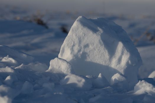 A detailed shot showcasing a unique snow formation on a cold winter day in Elgin, MN.