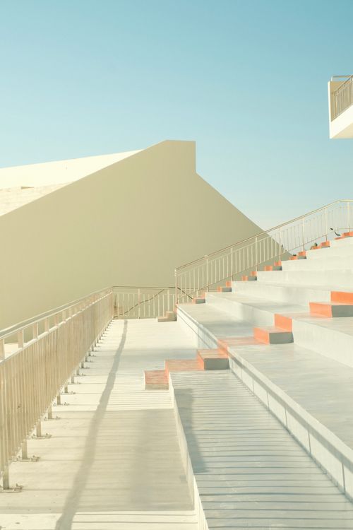 Free Elegant minimalist architecture featuring modern geometric stairs and clean lines. Stock Photo