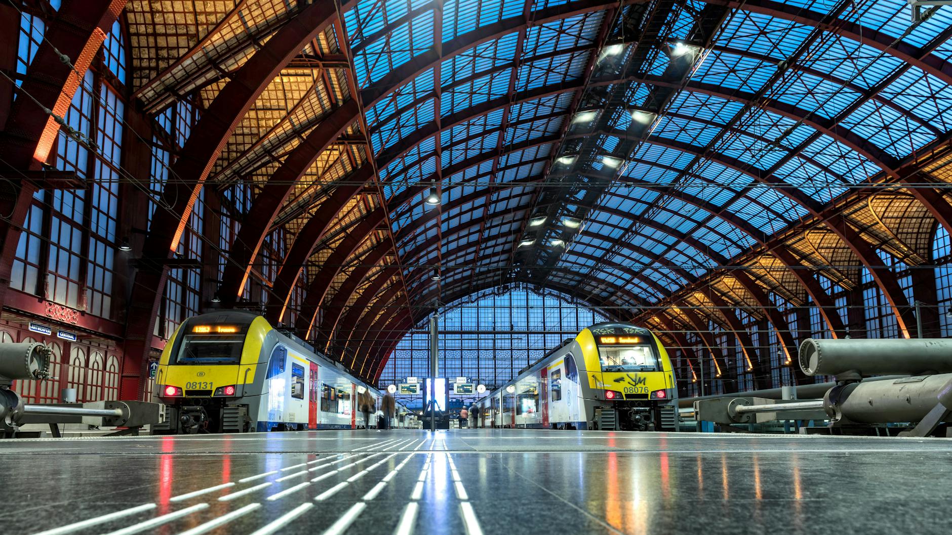 Modern trains beneath the main hall of Antwerp Central Station in Belgium.
