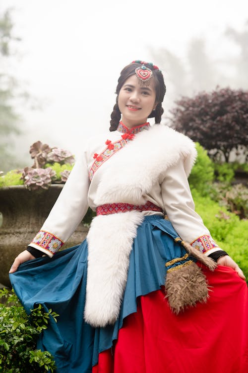 Smiling Woman Posing in Traditional Clothing
