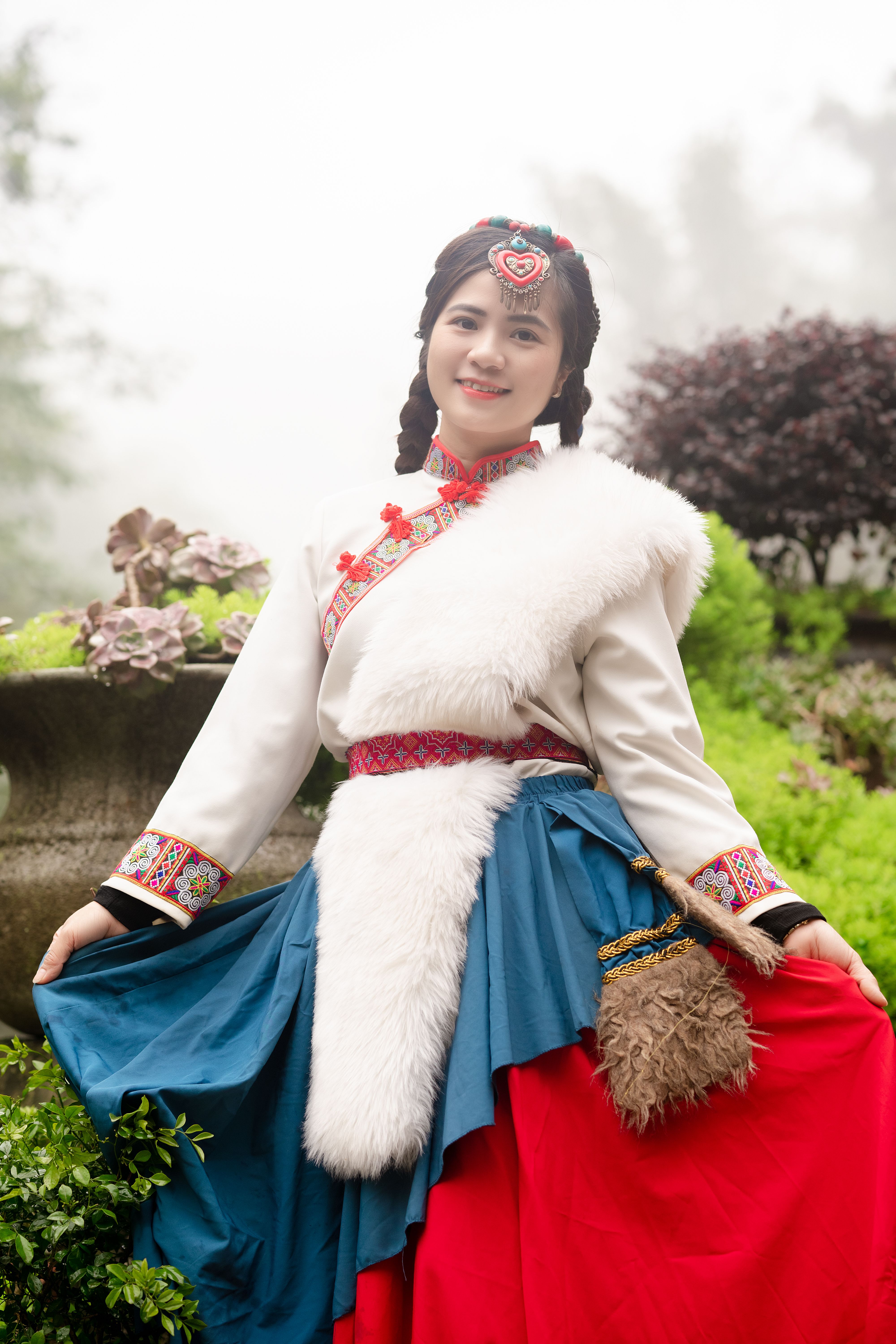Smiling Woman Posing in Traditional Clothing · Free Stock Photo