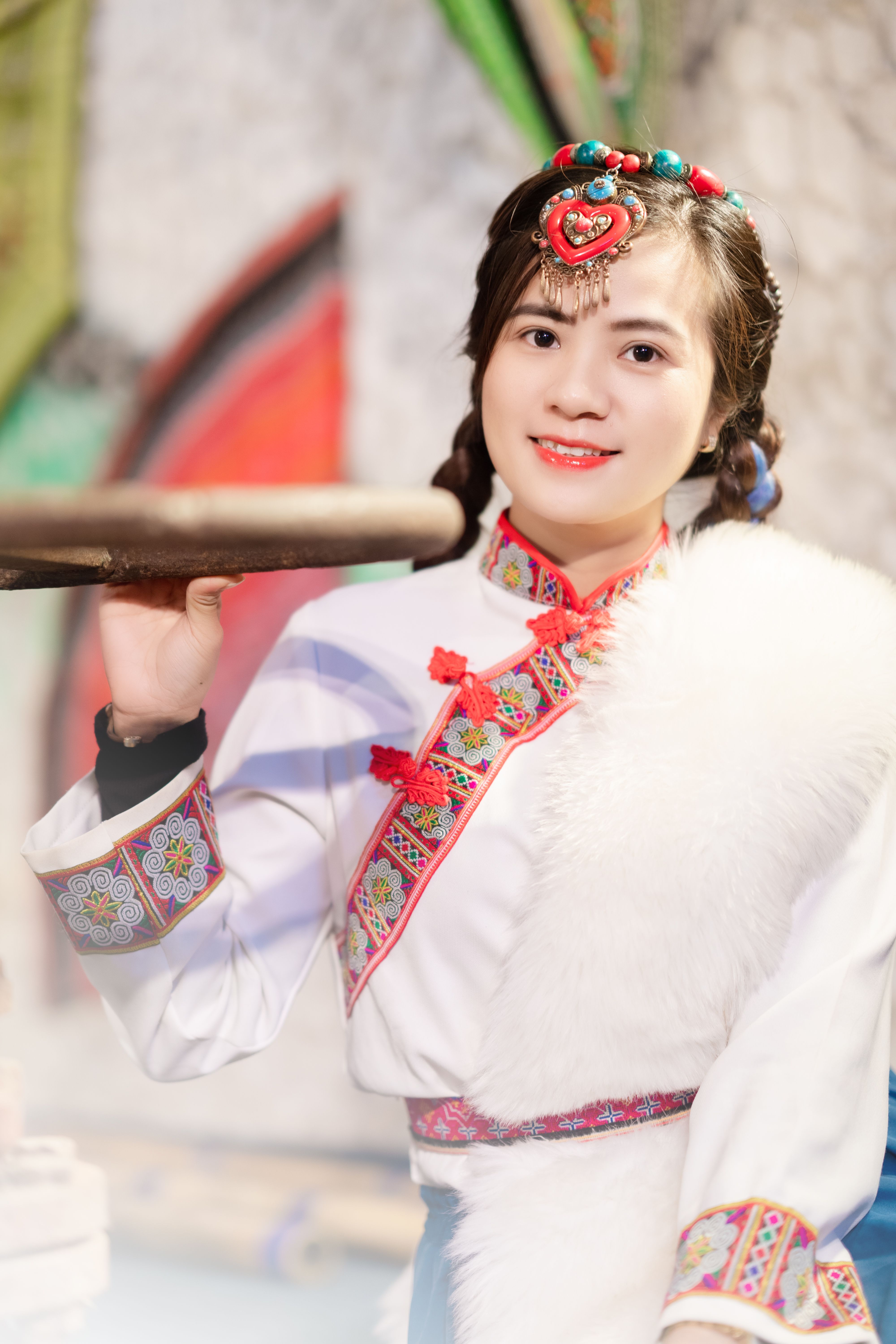 Photo of a Smiling Young Woman in Traditional Clothing · Free Stock Photo