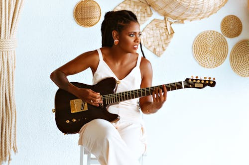 Young Woman Playing an Electric Guitar 