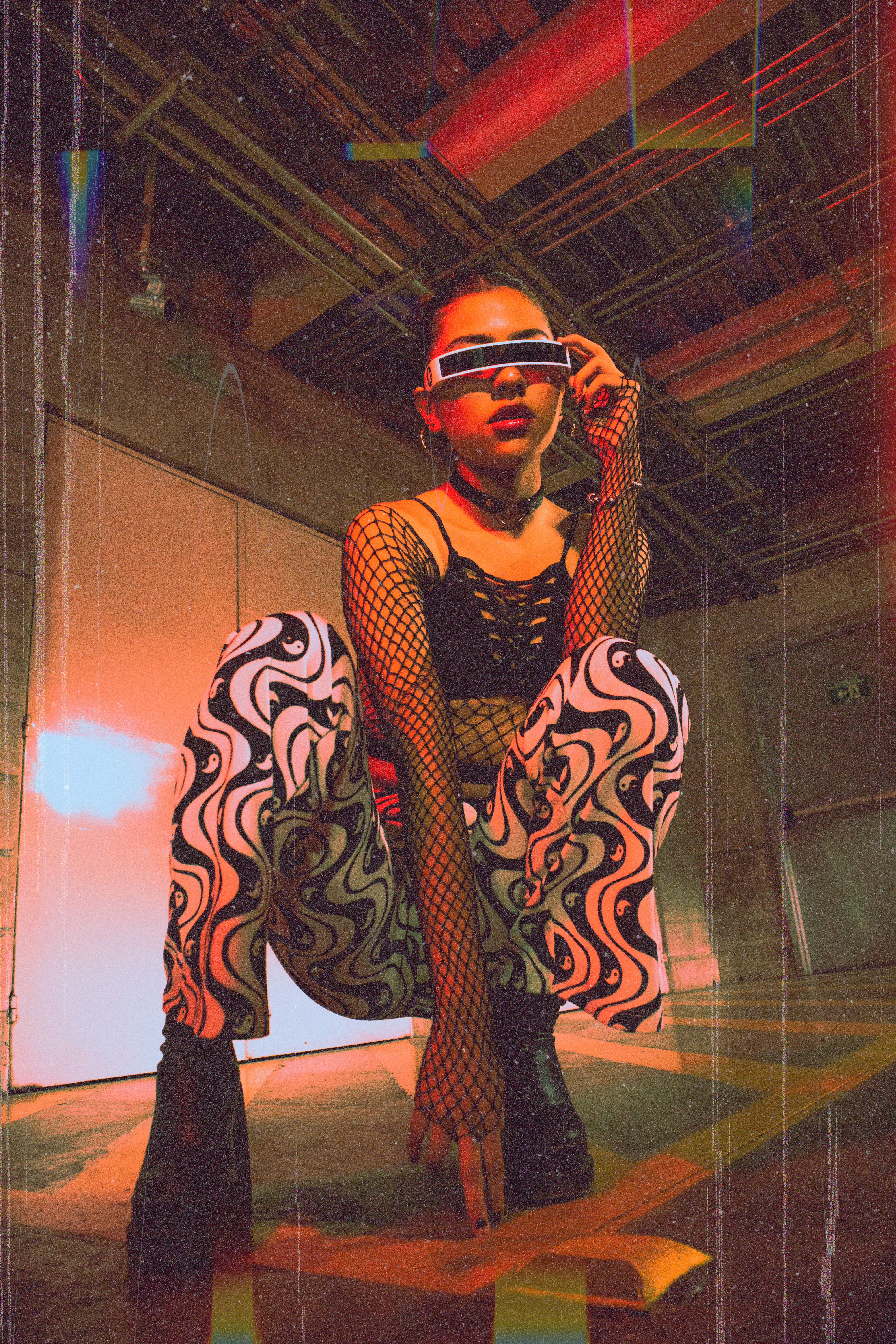 Model in a Black Sailor Uniform with a Pink Bow and Fishnet Stockings ...