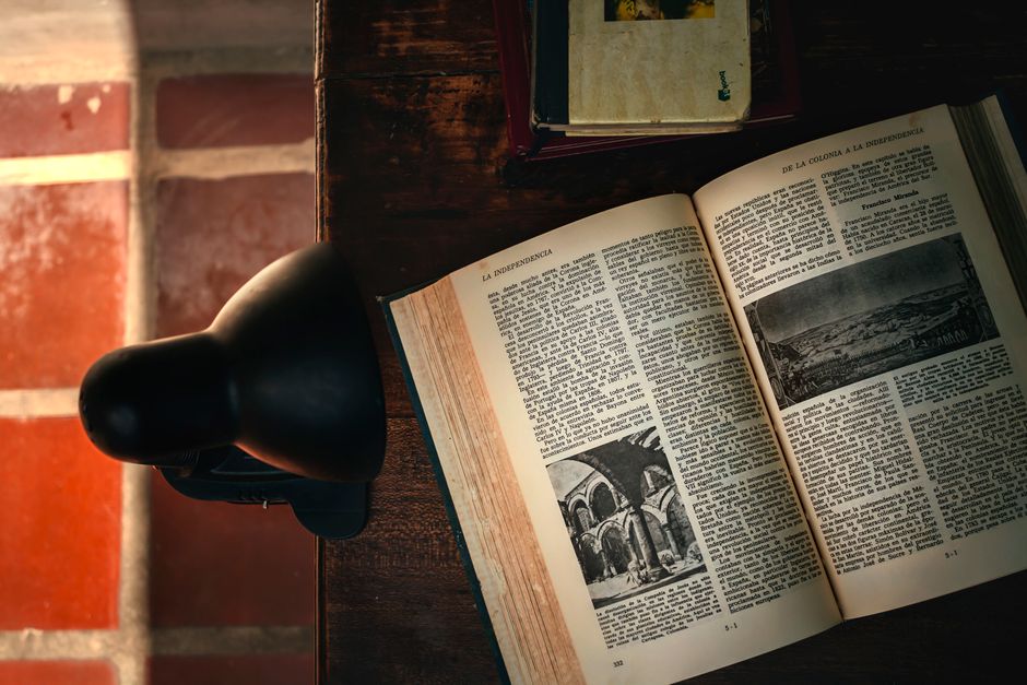 journal and lamp on desk candid lifestyle lifestyle photo 1