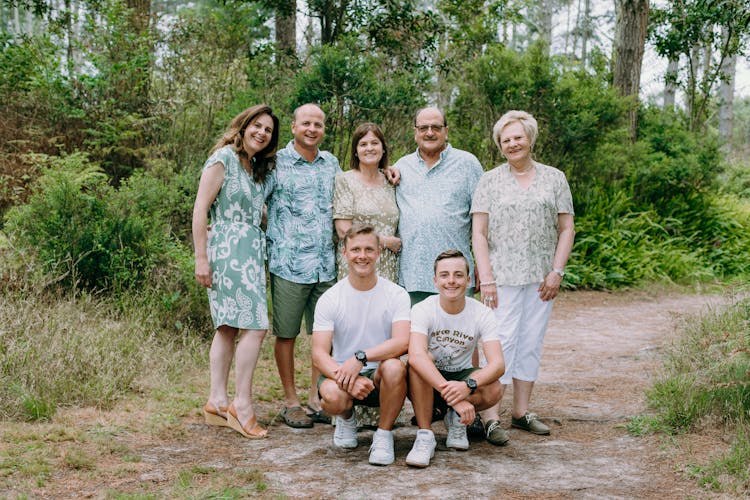 Smiling Family In A Forest 