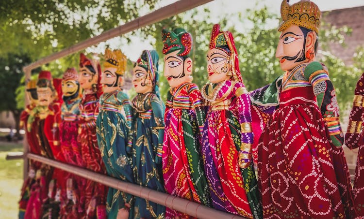 Male And Female Dolls With Colorful Costumes