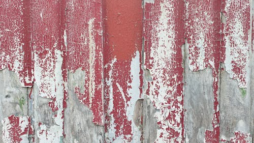 Cracked Red Paint on Wooden Wall